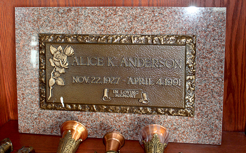 Bronze Memorial Plaque on Monument from Sunset Memorial and Stone